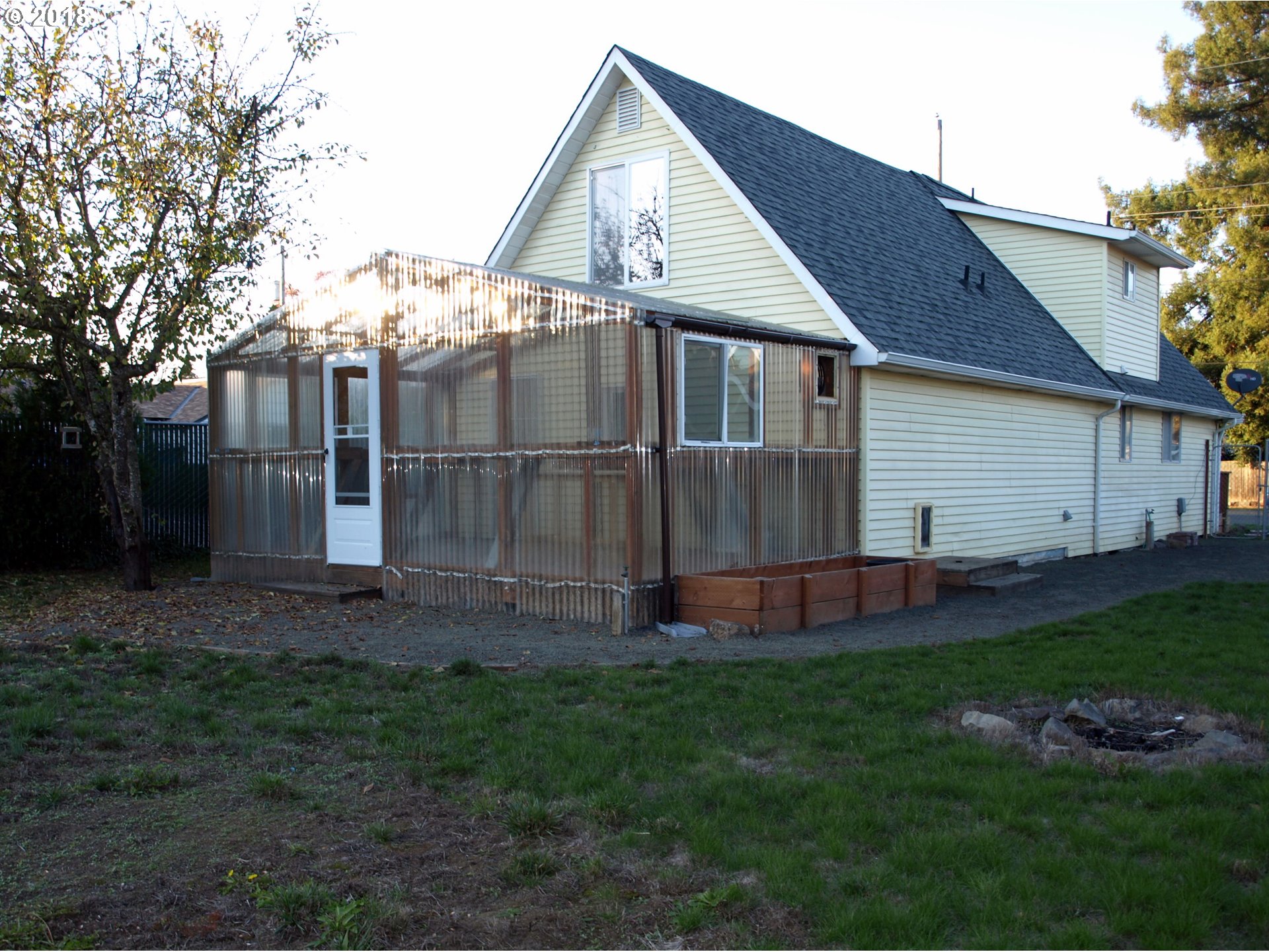 661 West M Street Springfield, OR 97477 - Photo 12 of 13 a view of backyard with table and chairs and potted plants