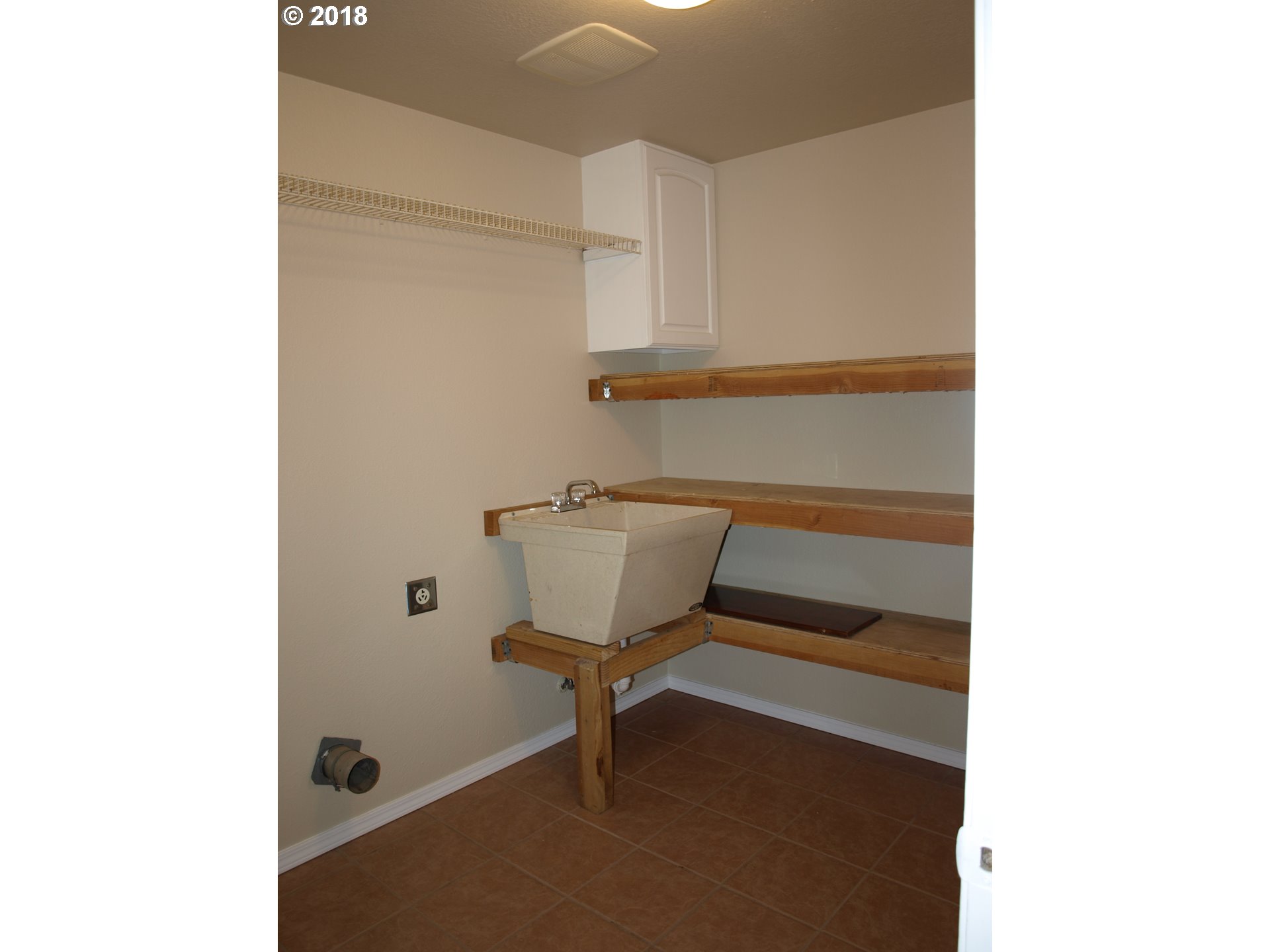 661 West M Street Springfield, OR 97477 - Photo 6 of 13 a bathroom with a sink and a toilet