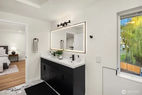 a en suite bathroom with a sink and a mirror