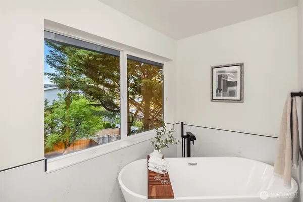 a bathroom with a bathtub and a sink