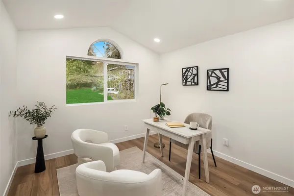 a workspace with furniture and window