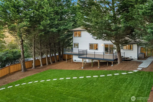 a view of a house with a backyard porch and sitting area
