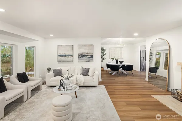 a living room with furniture or couch and a potted plant