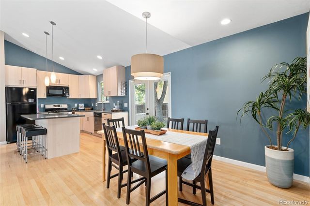 a kitchen with a table and chairs in it