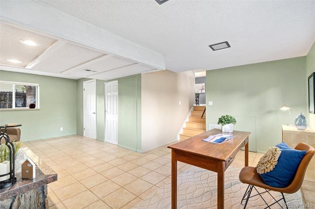 a bedroom with a bed and a table in it