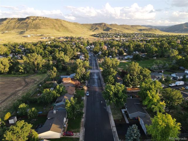 a view of a city with mountains in the background
