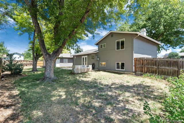 a house with trees in the background
