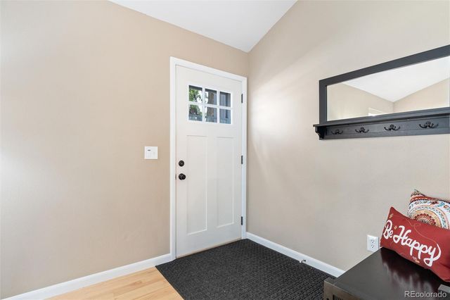 a view of room with window and wooden floor