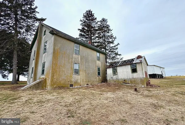 a house with trees in front of it