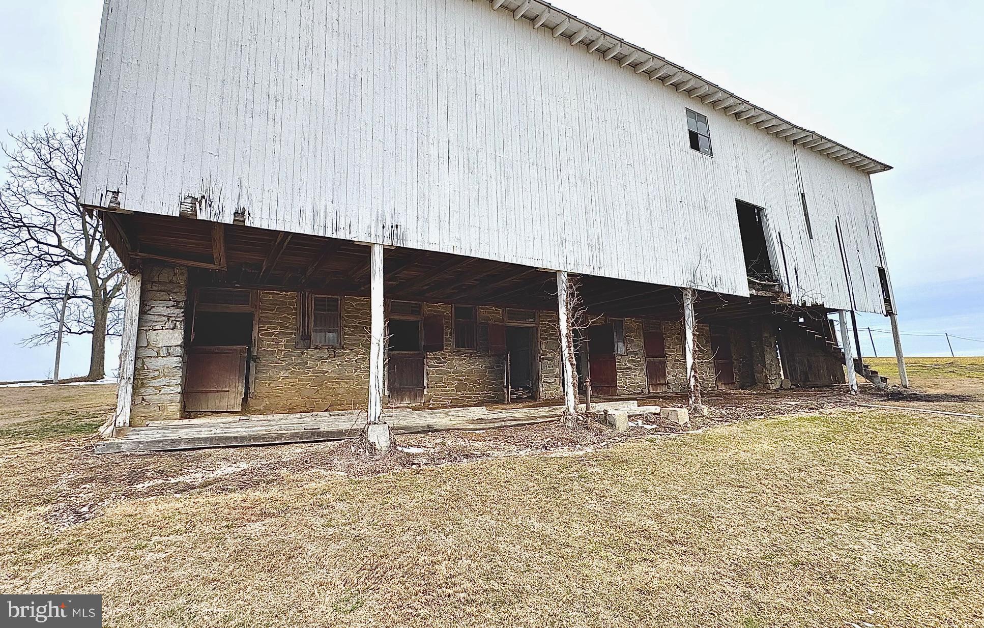 133 Hunter Road Oley, PA 19547 - Photo 20 of 29 a view of a house with a backyard and a window