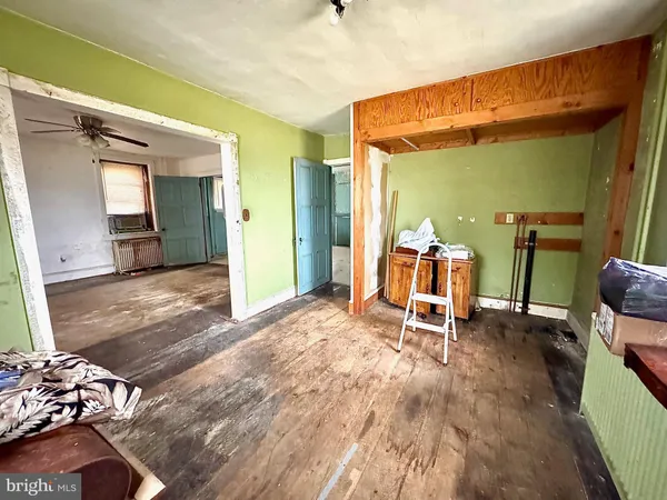 a dining room with table and chairs