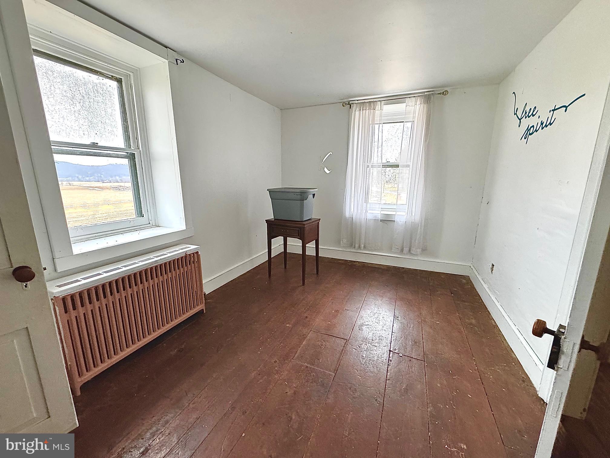 133 Hunter Road Oley, PA 19547 - Photo 10 of 29 wooden floor in an empty room with a window