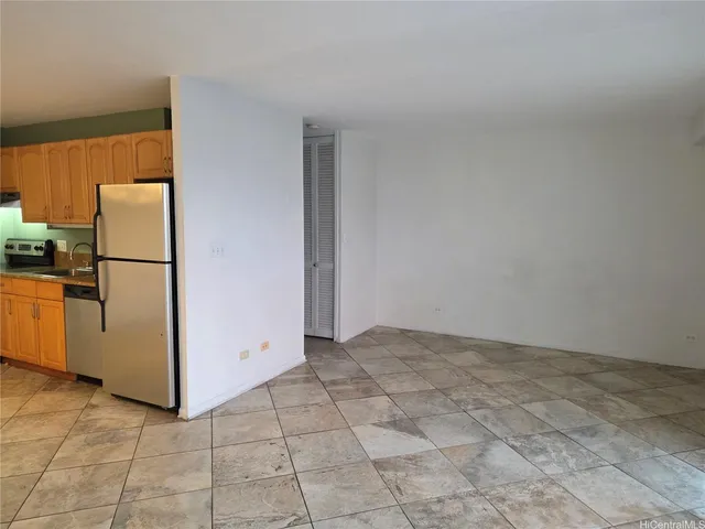 a view of a kitchen with refrigerator and microwave