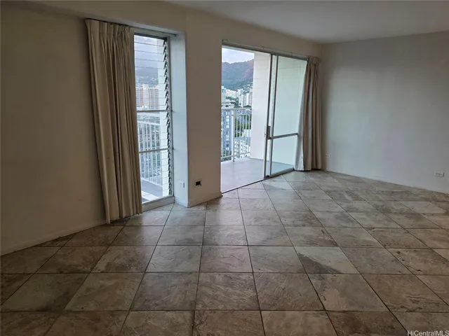 a view of an empty room with windows