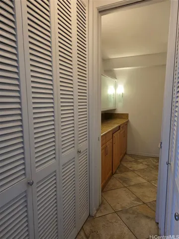 a room with pool table and windows