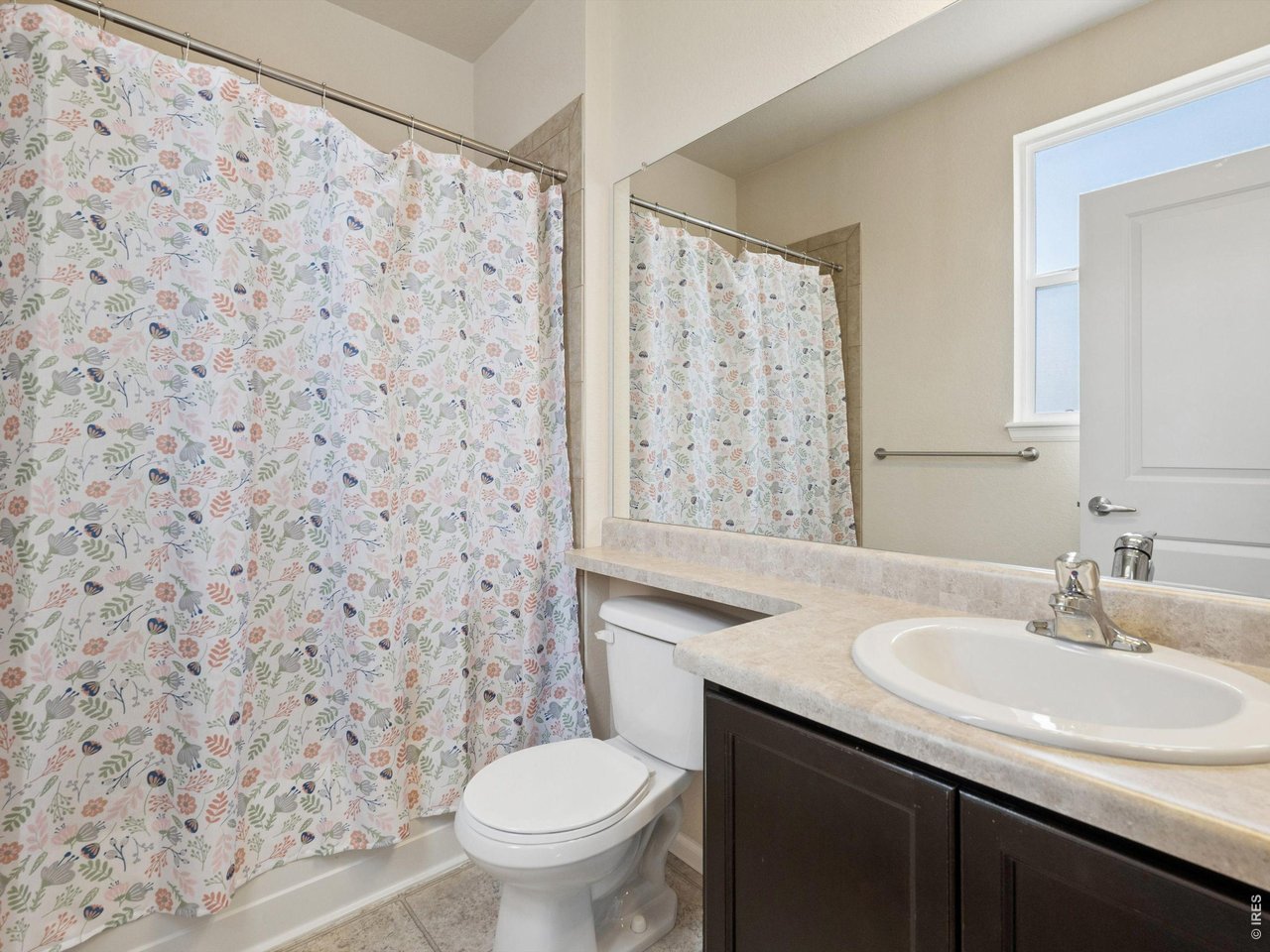 11202 Colony Circle Broomfield, CO 80021 - Photo 16 of 23 a bathroom with a sink toilet and a mirror