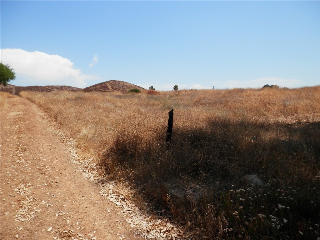 A Hemlock Street Wildomar, CA 92584 - Photo 5 of 15 a view of a yard with a mountain