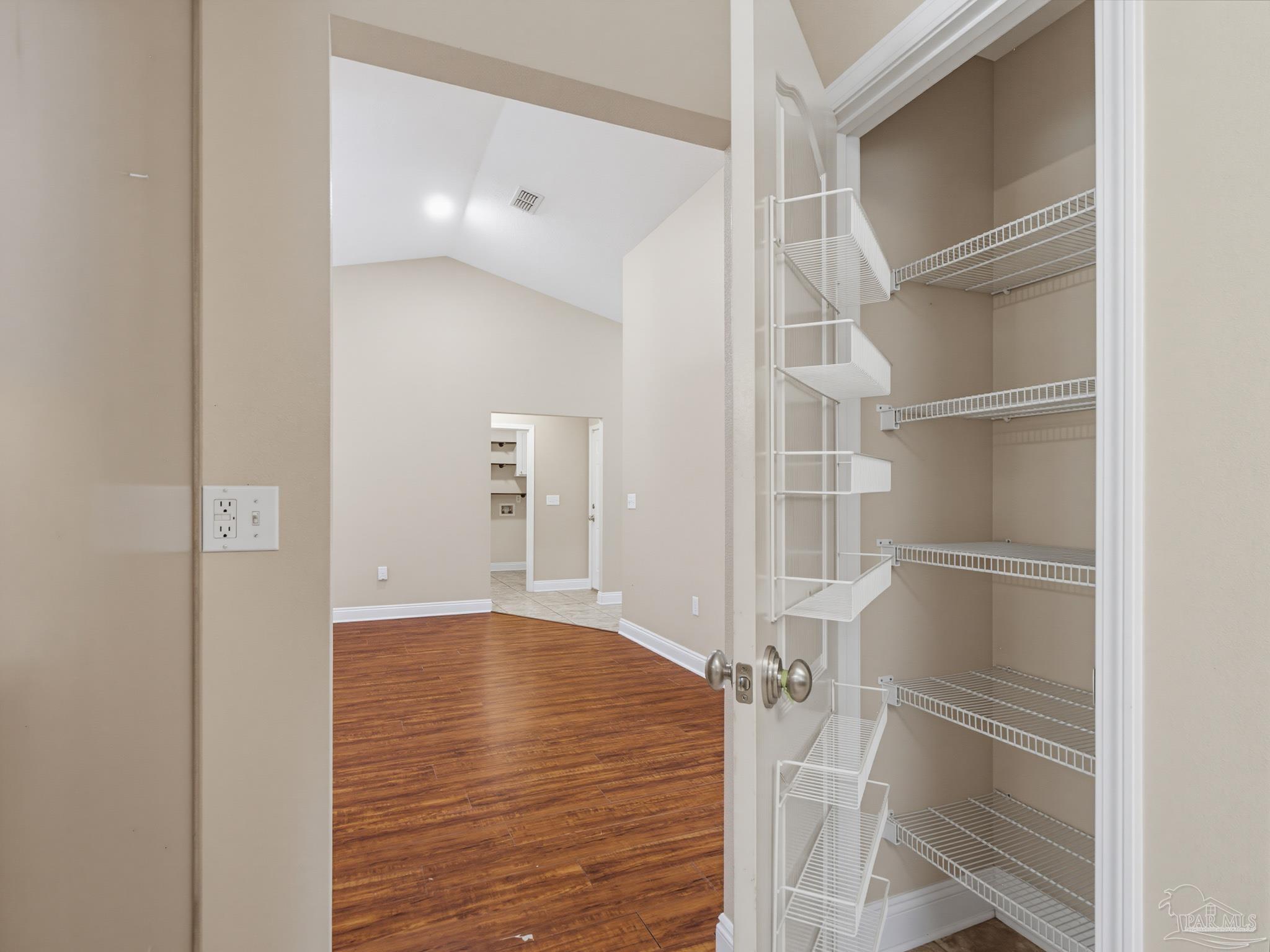 5567 Jones Street Milton, FL 32570 - Photo 21 of 48 a view of empty room with wooden floor