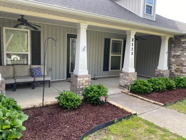 a front view of a house with garden
