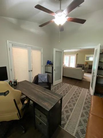 a view of a livingroom with furniture and a table