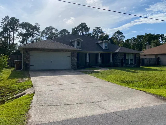 a view of a house with a garden