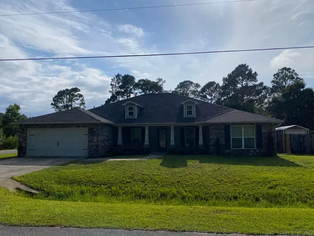 a view of a house with a garden