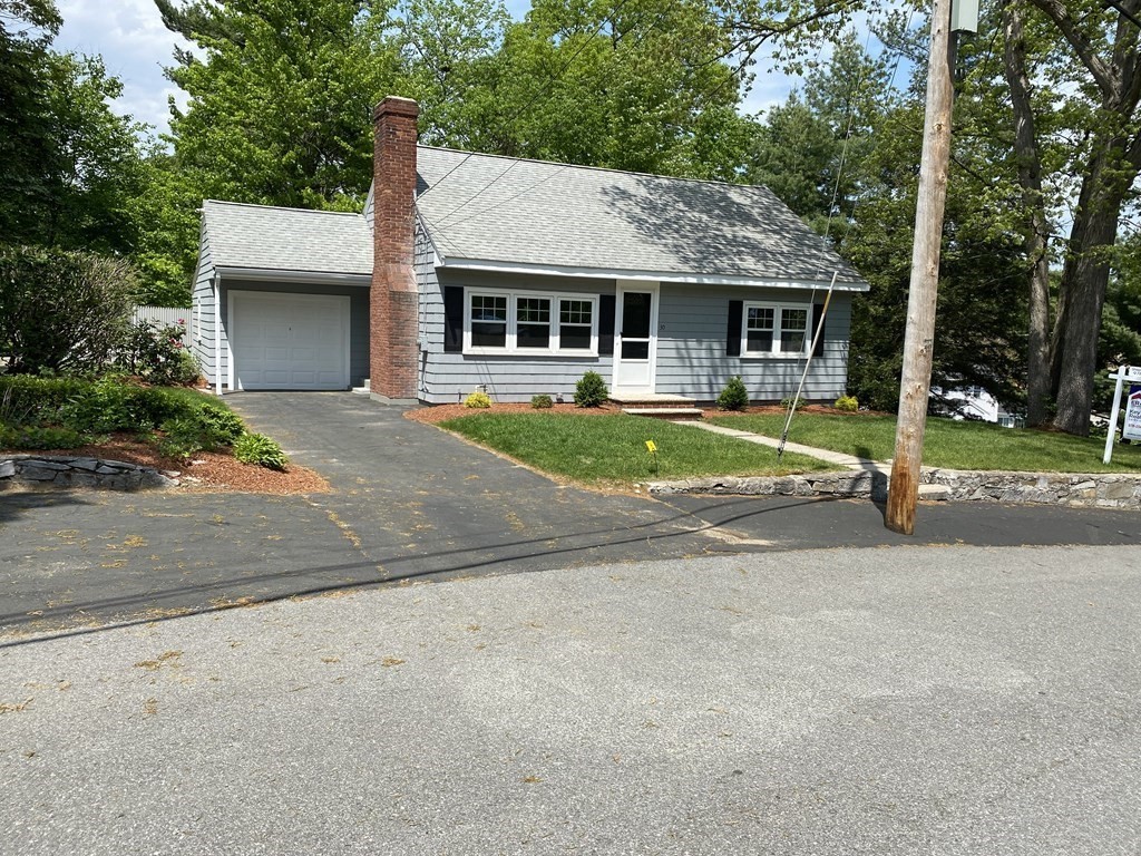 30 Arbor Road Chelmsford, MA 01863 - Photo 1 of 32 a front view of a house with a yard and garage