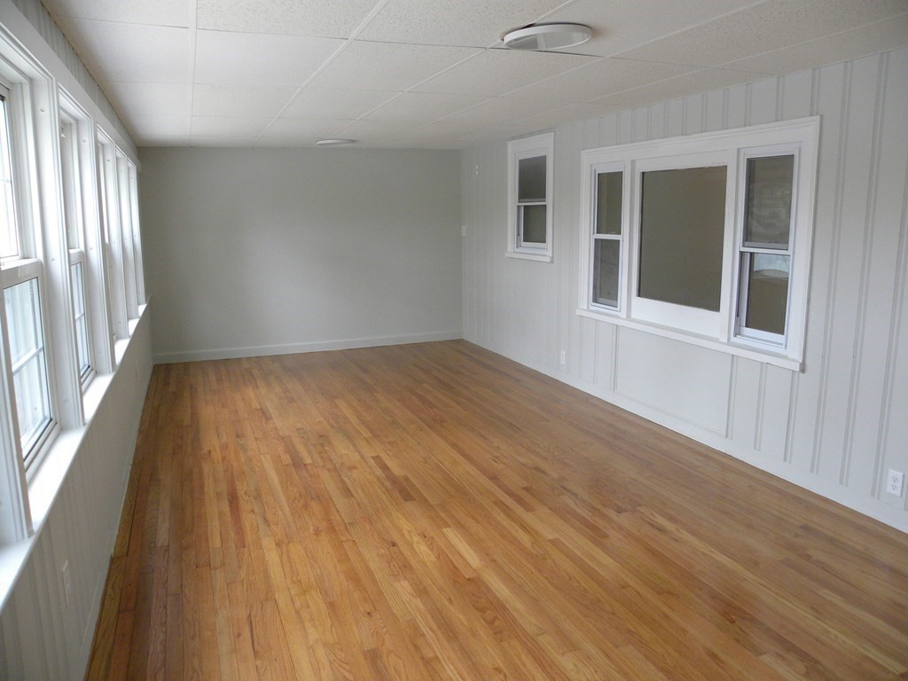 30 Arbor Road Chelmsford, MA 01863 - Photo 14 of 32 a view of an empty room with wooden floor and a window
