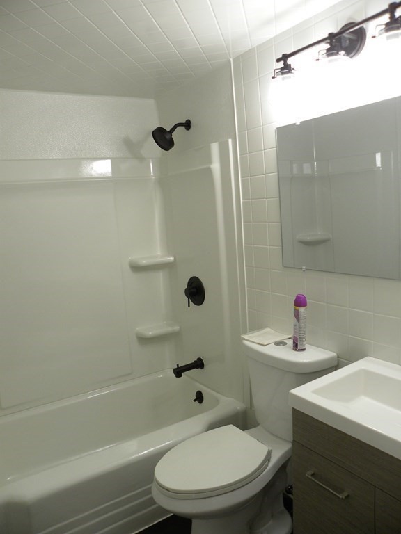 30 Arbor Road Chelmsford, MA 01863 - Photo 17 of 32 a bathroom with a sink toilet and shower
