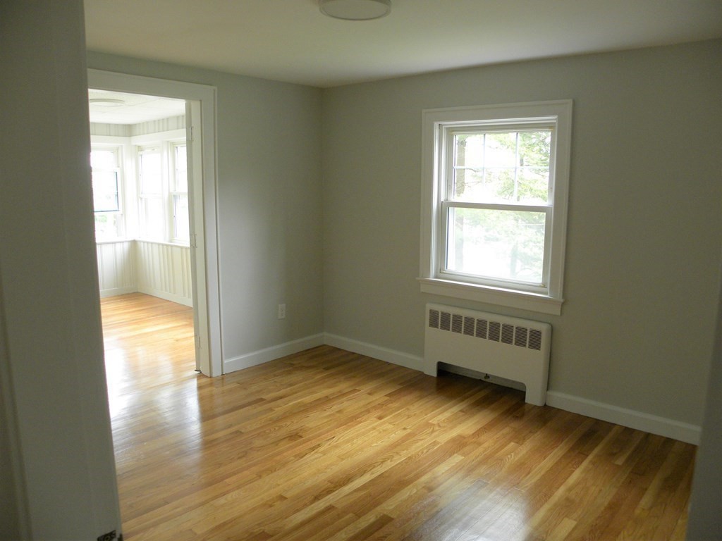 30 Arbor Road Chelmsford, MA 01863 - Photo 18 of 32 an empty room with wooden floor and windows