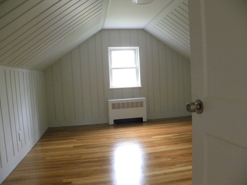 30 Arbor Road Chelmsford, MA 01863 - Photo 20 of 32 a view of an empty room with wooden floor and a window