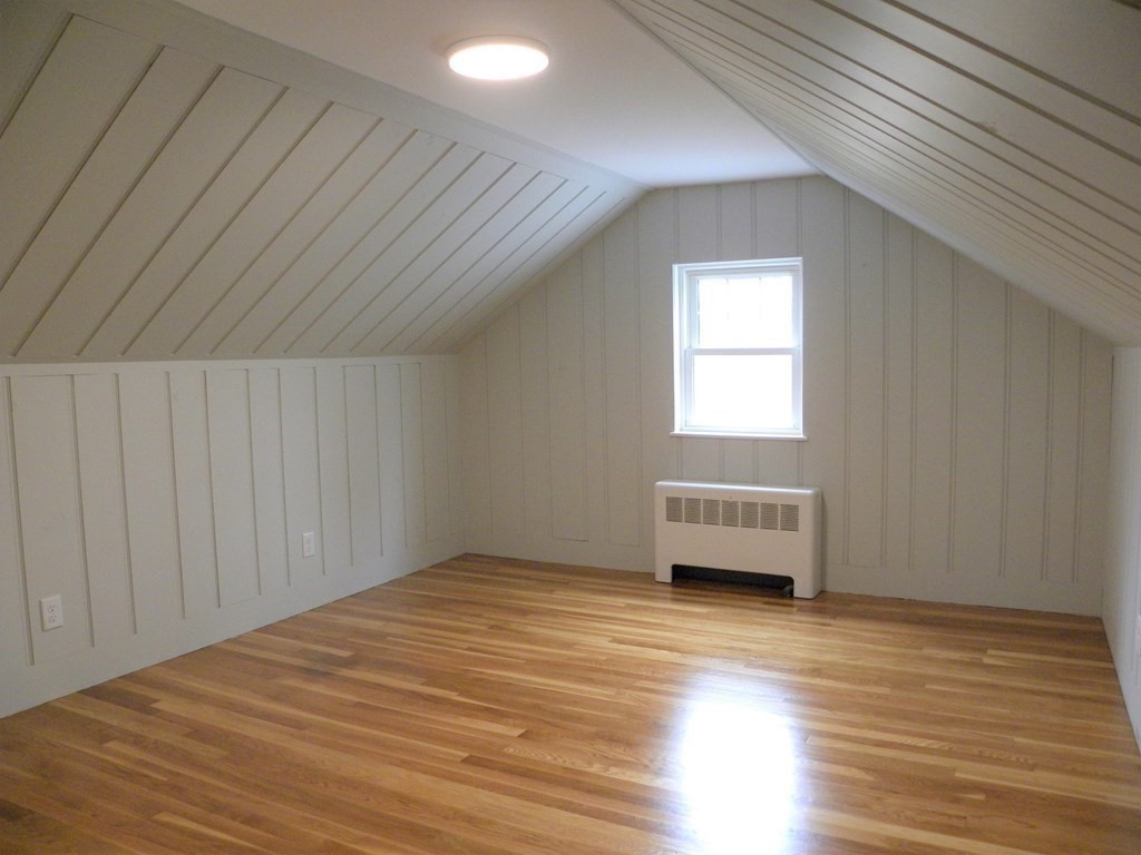 30 Arbor Road Chelmsford, MA 01863 - Photo 22 of 32 an empty room with wooden floor and windows