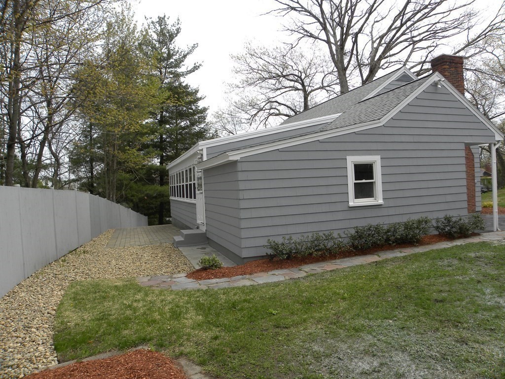 30 Arbor Road Chelmsford, MA 01863 - Photo 3 of 32 a view of a backyard with plants and large tree