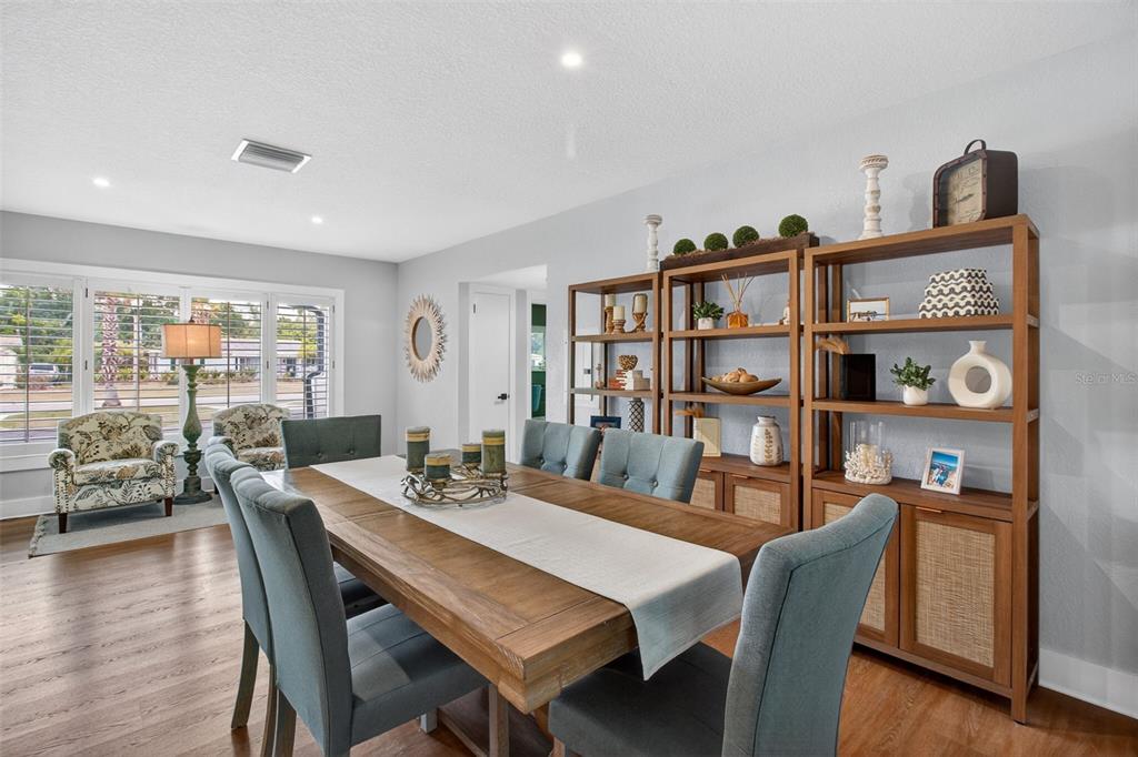 1714 Indian Rocks Road Belleair, FL 33756 - Photo 12 of 62 a view of a dining room with furniture and wooden floor
