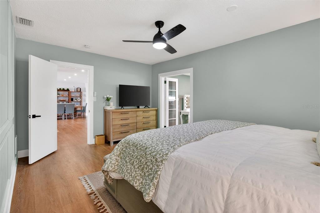 1714 Indian Rocks Road Belleair, FL 33756 - Photo 27 of 62 a bedroom with a bed and a flat screen tv