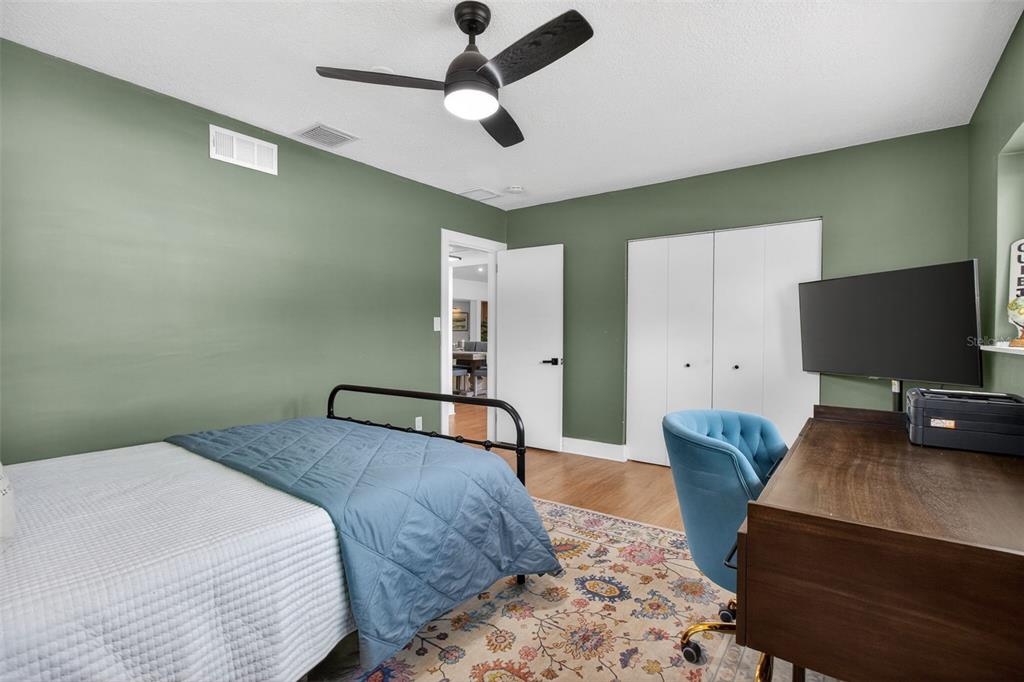 1714 Indian Rocks Road Belleair, FL 33756 - Photo 35 of 62 a bedroom with a bed and a flat screen tv