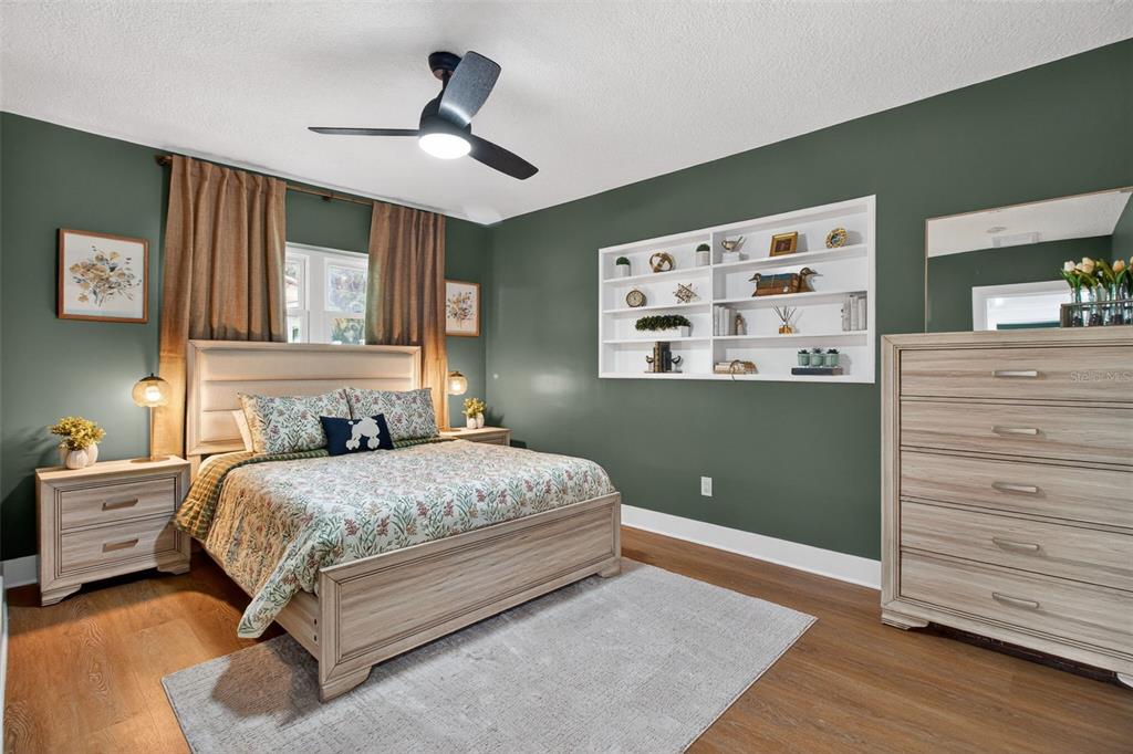 1714 Indian Rocks Road Belleair, FL 33756 - Photo 37 of 62 a bedroom with a bed and a dresser