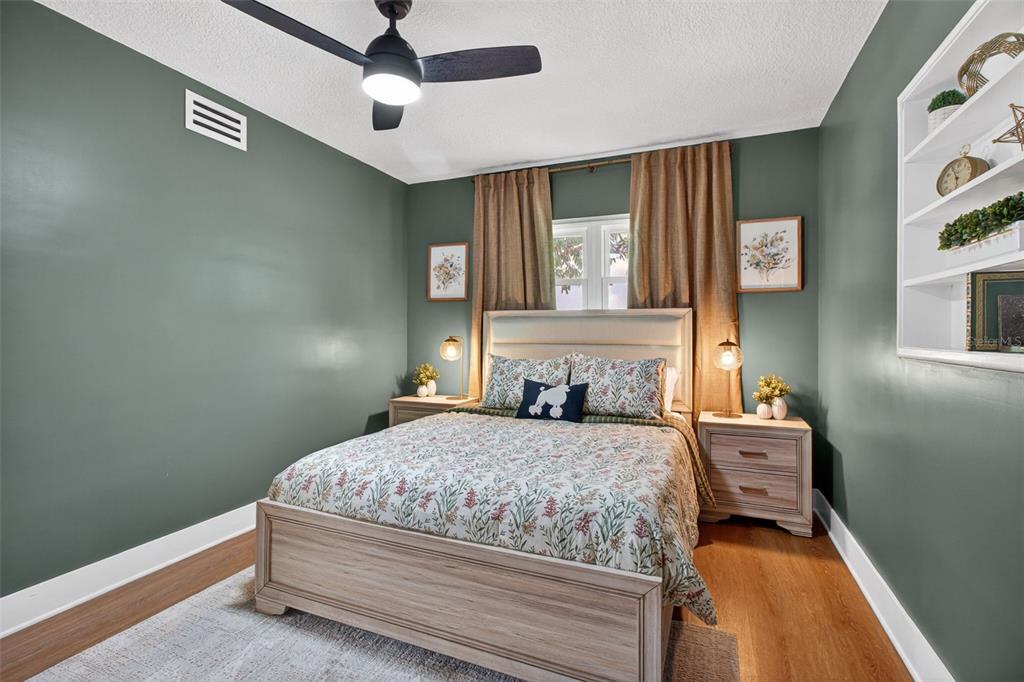 1714 Indian Rocks Road Belleair, FL 33756 - Photo 38 of 62 a bedroom with a bed and a chandelier