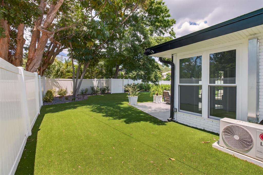 1714 Indian Rocks Road Belleair, FL 33756 - Photo 45 of 62 a view of a backyard with table and chairs and potted plants