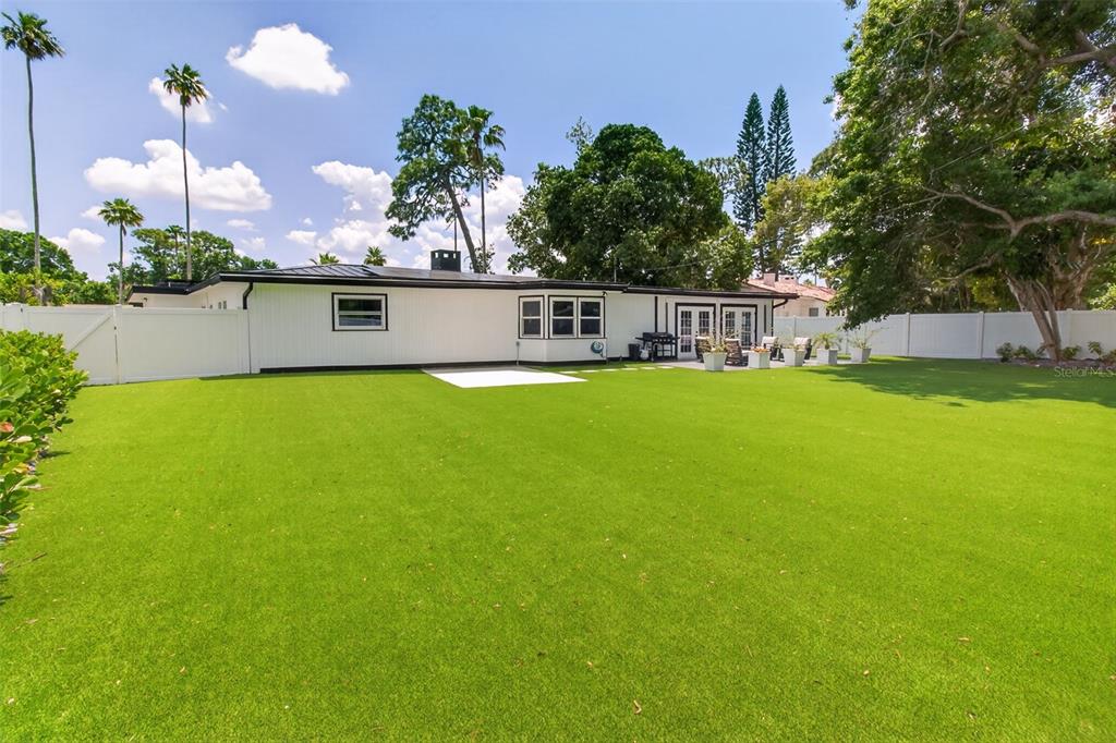 1714 Indian Rocks Road Belleair, FL 33756 - Photo 46 of 62 a view of a house with a yard and potted plants