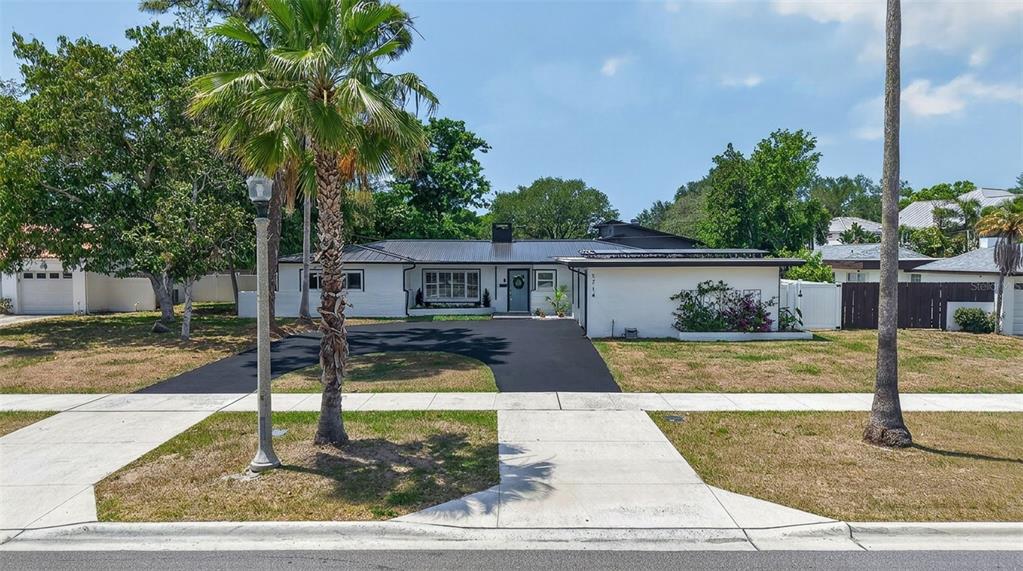 1714 Indian Rocks Road Belleair, FL 33756 - Photo 60 of 62 front view of a house with a yard