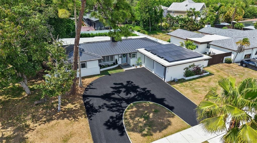 1714 Indian Rocks Road Belleair, FL 33756 - Photo 61 of 62 an aerial view of a house with a swimming pool and outdoor space
