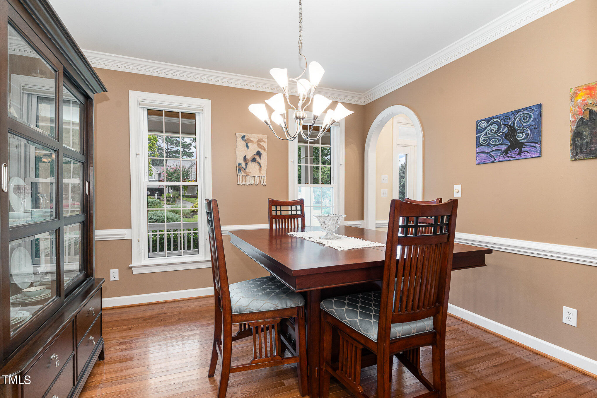 2719 Amstel Way Raleigh, NC 27613 - Photo 8 of 41 a view of a dining room with furniture window and wooden floor