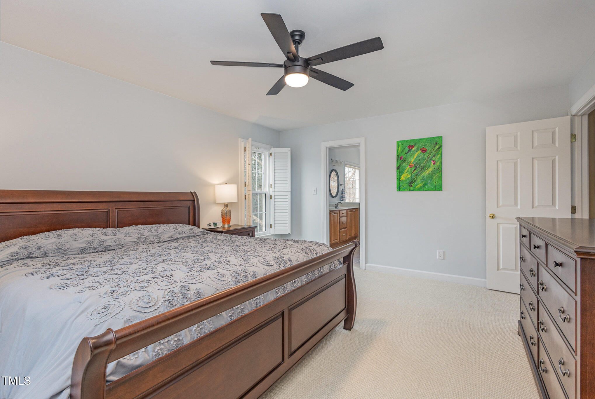 2719 Amstel Way Raleigh, NC 27613 - Photo 17 of 41 a bedroom with a bed and a dresser in it