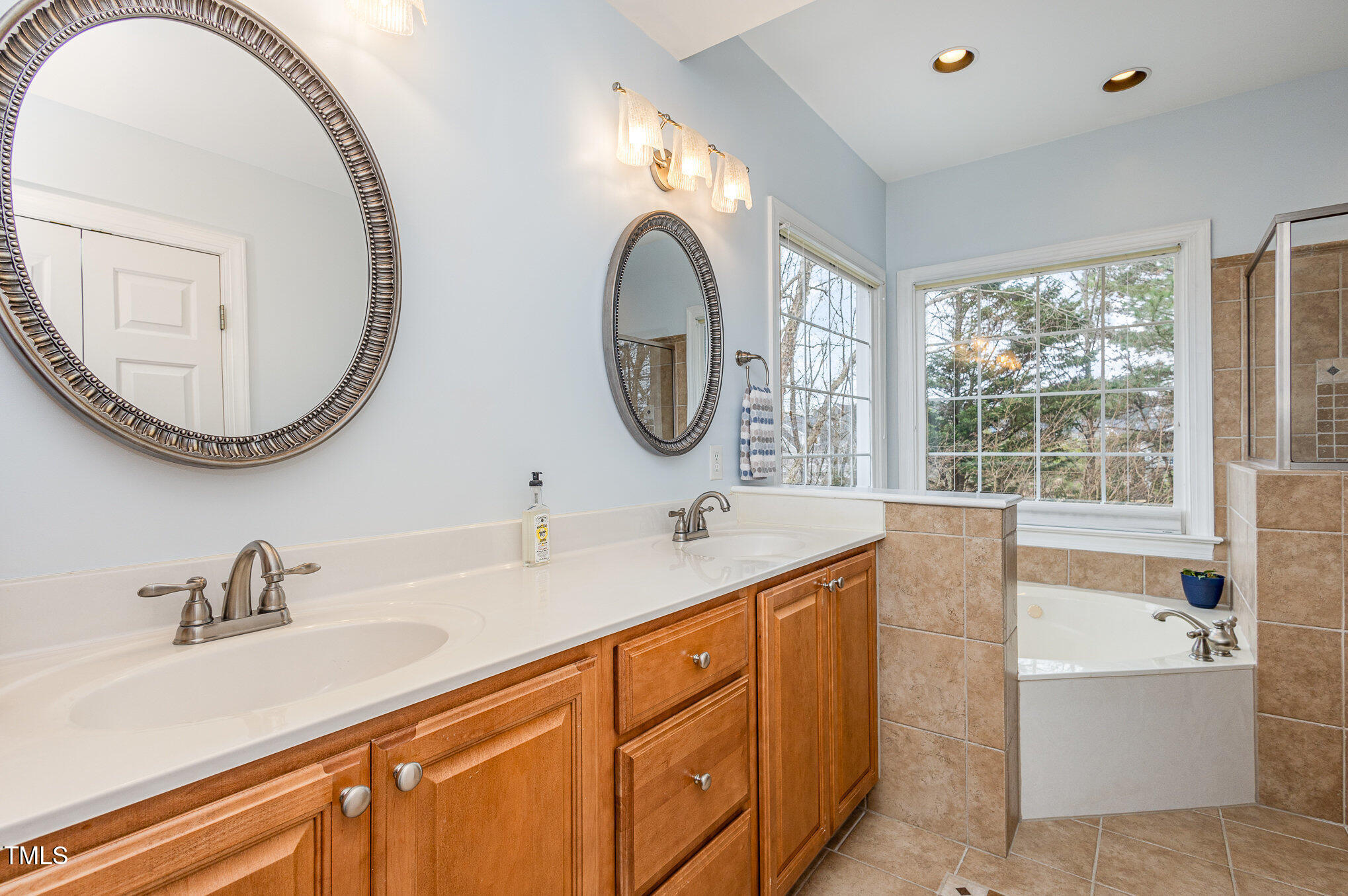 2719 Amstel Way Raleigh, NC 27613 - Photo 18 of 41 a bathroom with a sink and a mirror