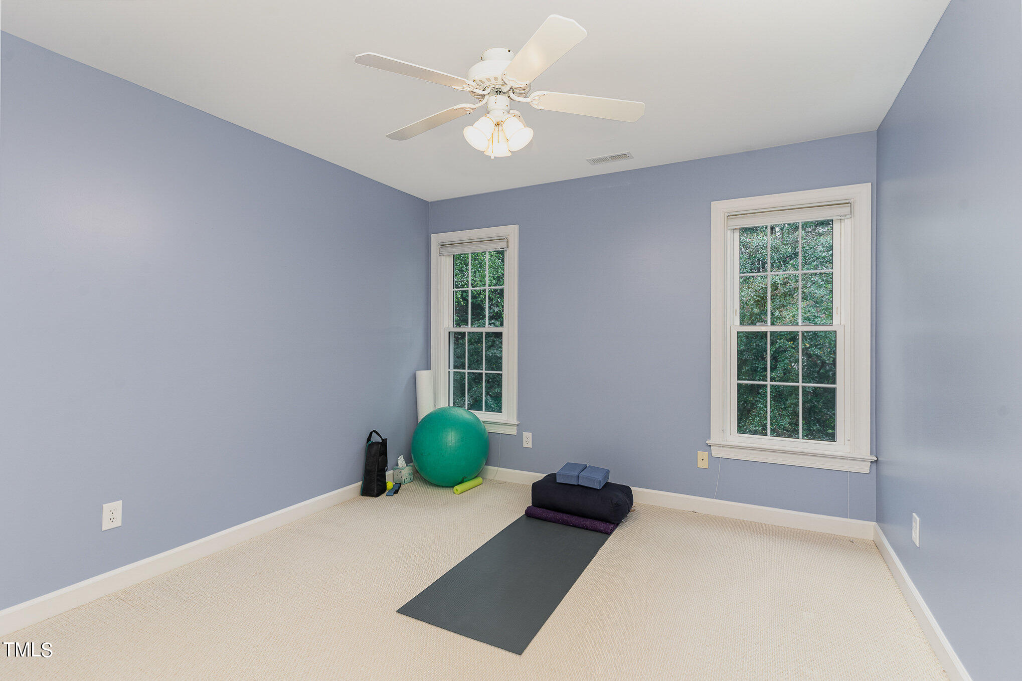 2719 Amstel Way Raleigh, NC 27613 - Photo 20 of 41 a view of an empty room with a window and a kitchen