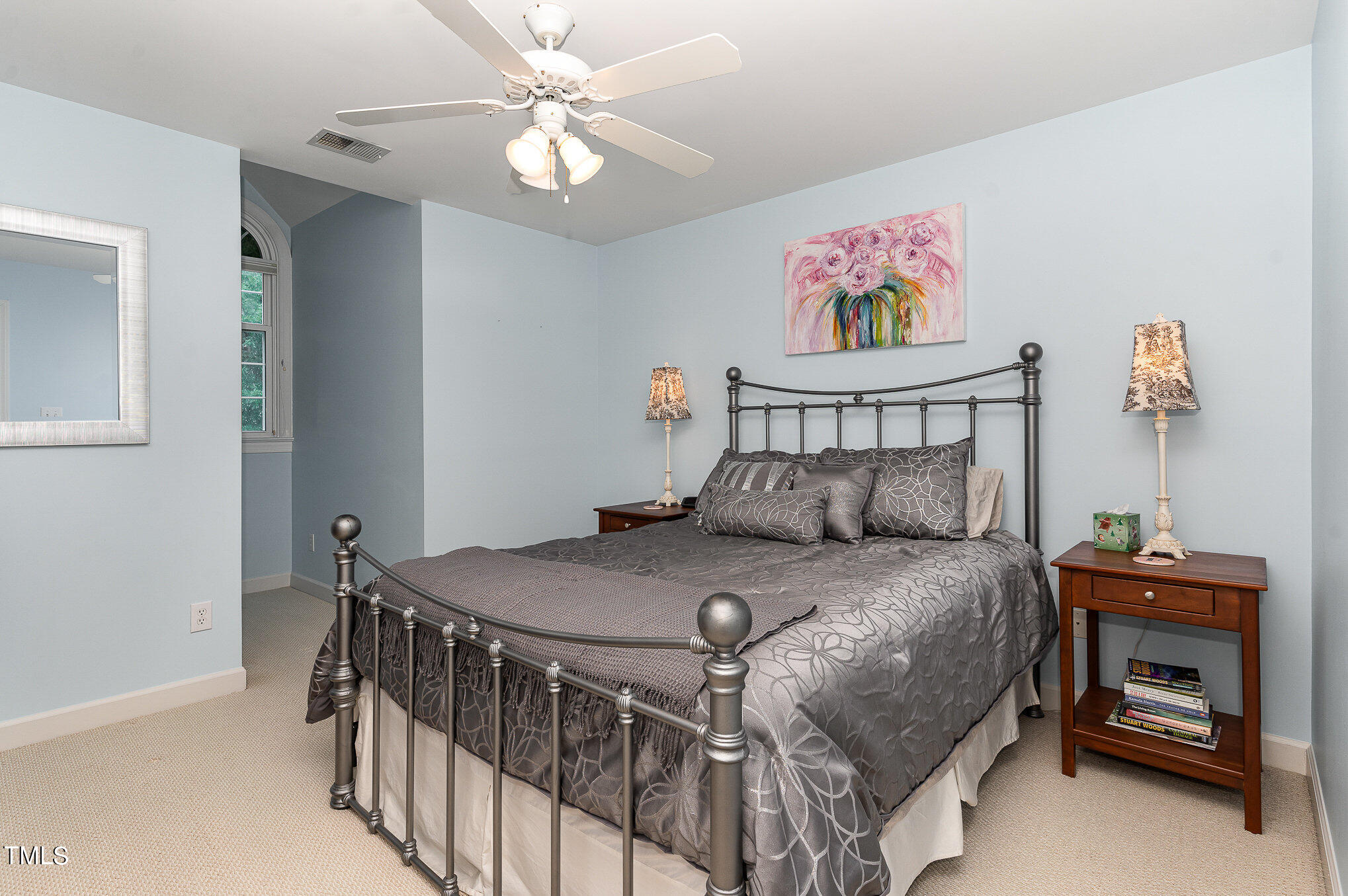 2719 Amstel Way Raleigh, NC 27613 - Photo 21 of 41 a bedroom with a bed and a chandelier