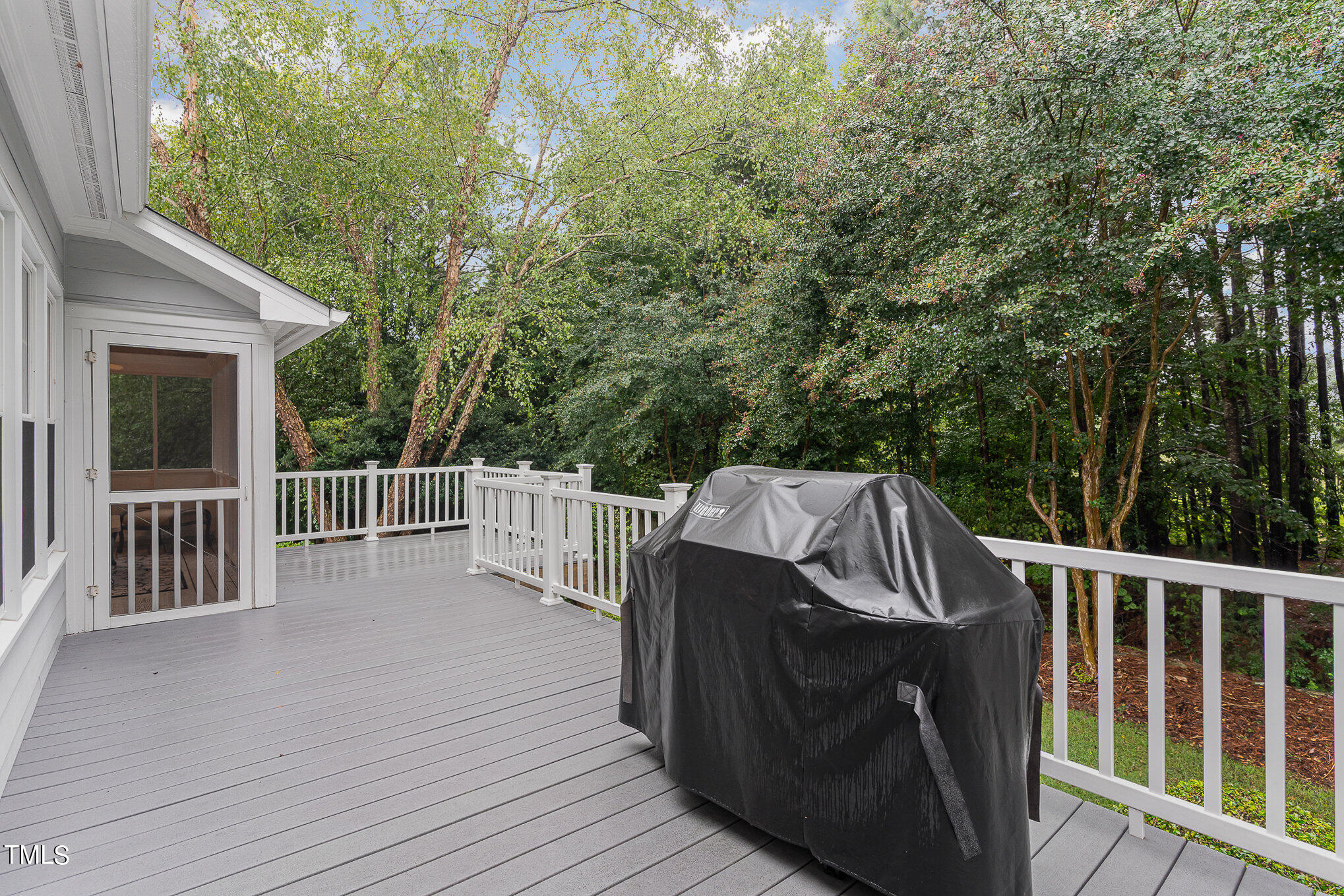 2719 Amstel Way Raleigh, NC 27613 - Photo 28 of 41 a view of a wooden deck and a backyard