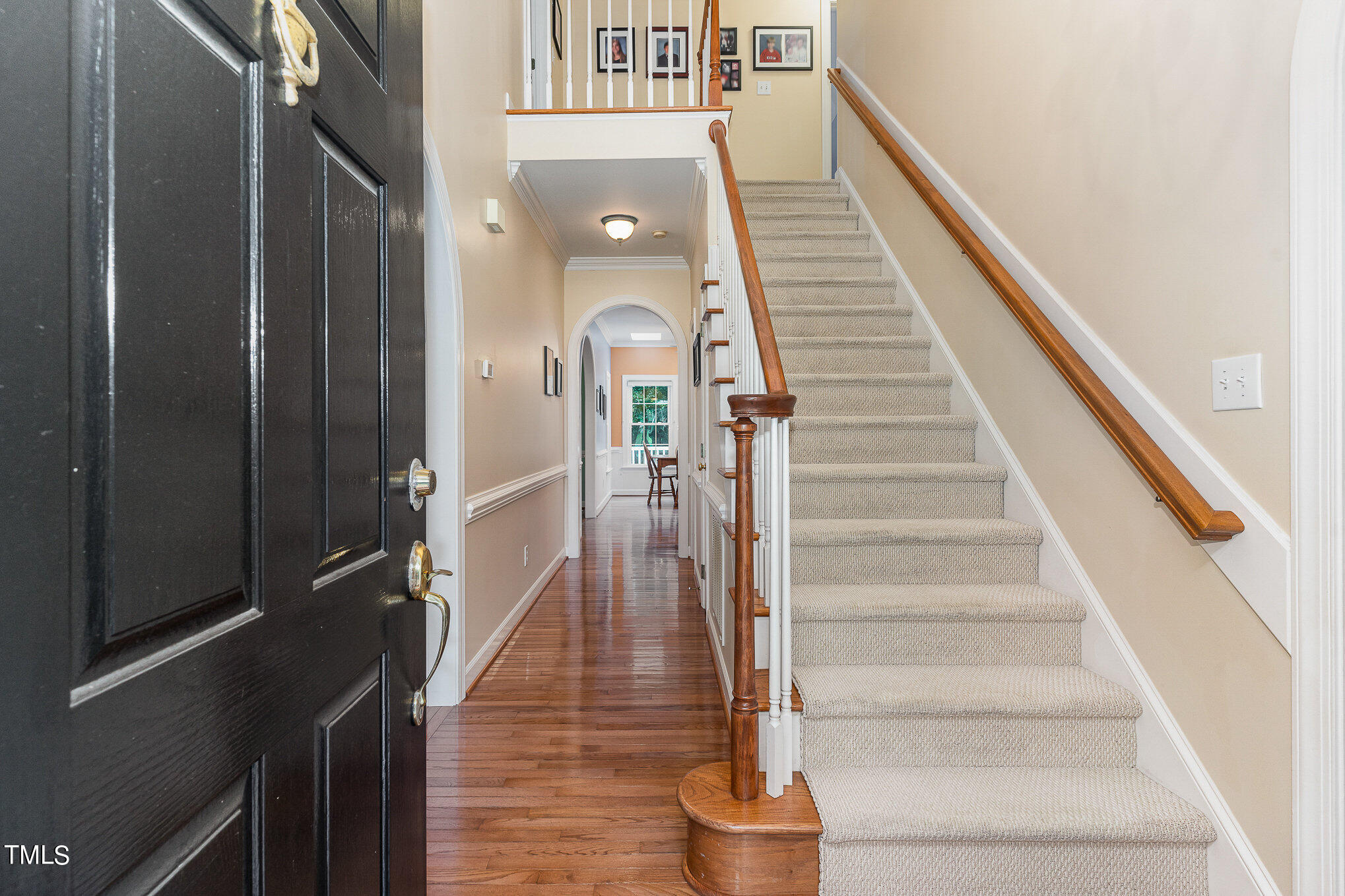 2719 Amstel Way Raleigh, NC 27613 - Photo 6 of 41 a view of entryway and hall with wooden floor