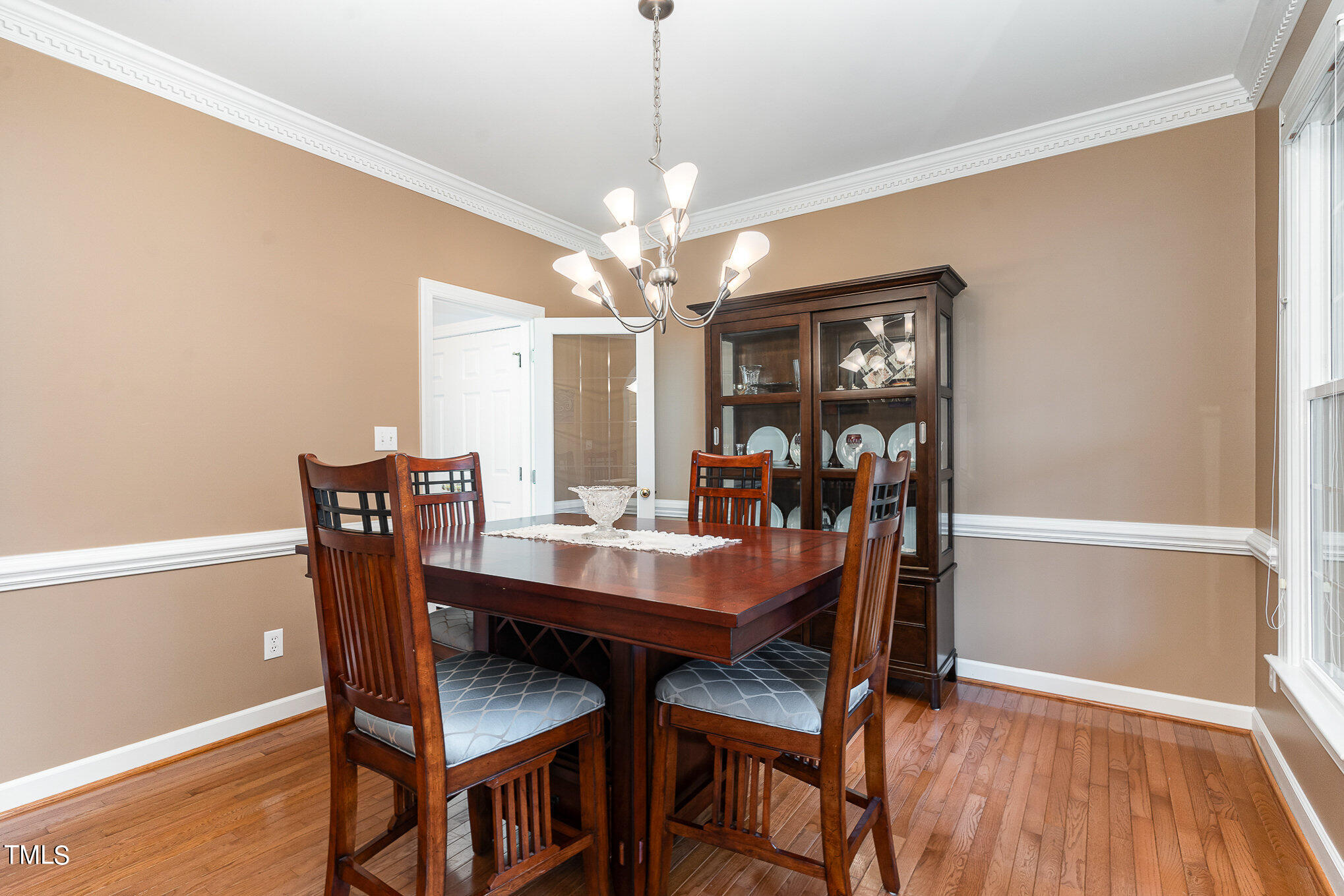2719 Amstel Way Raleigh, NC 27613 - Photo 7 of 41 a view of a dining room with furniture window and wooden floor
